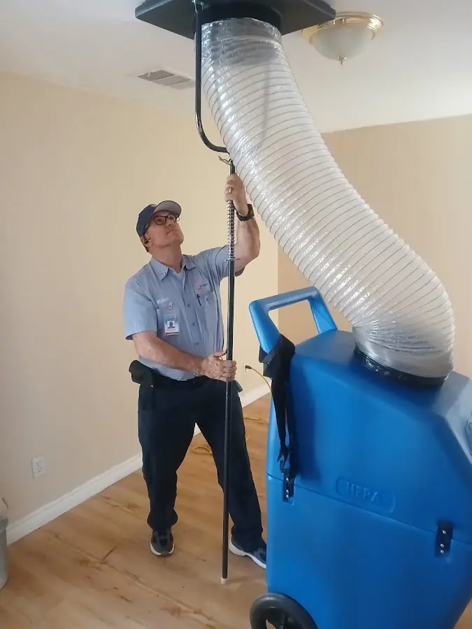HVAC Installation technician using HEPA equipment in Howard